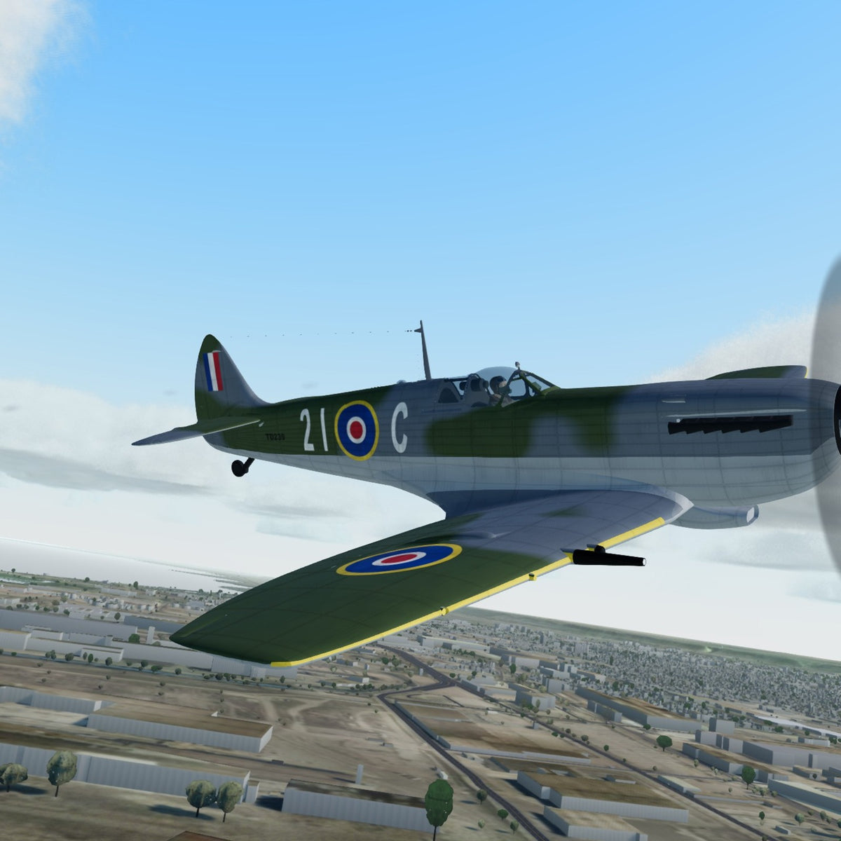 3D printed Supermarine Spitfire Mk.XVI model in TD239 21-C markings, in flight over Lake Ontario